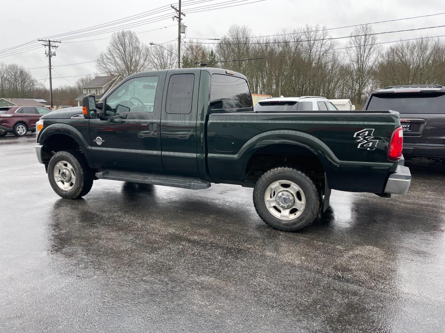 2015 Green /Gray Ford F-250 SD XLT SuperCab Long Bed 4WD (1FT7X2BT6FE) with an 6.7L V8 OHV 16V DIESEL engine, 6-Speed Automatic transmission, located at 547 E. Main St., Orwell, OH, 44076, (440) 437-5893, 41.535435, -80.847855 - Photo#14